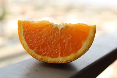 Close-up of orange slice on table