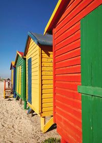 View of beach huts against sky