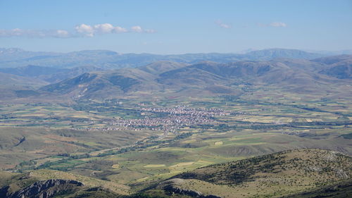 Aerial view of agricultural field against sky