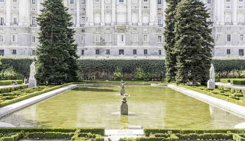 Pond against royal palace of madrid