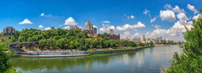 Monument to the fallen afghan warriors on the dnipro embankment in ukraine on a sunny summer day