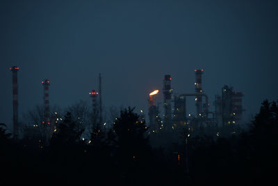 Panoramic view of illuminated city against clear sky at night