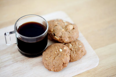 High angle view of cookies and coffee on table