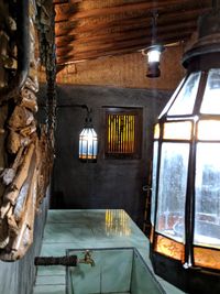 Illuminated electric lamp hanging on window