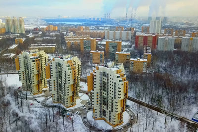 High angle view of buildings against sky during winter