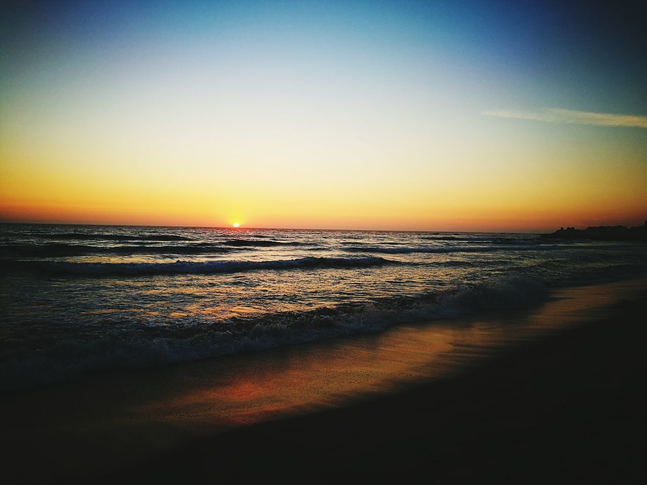 sea, sunset, beach, horizon over water, water, shore, scenics, tranquil scene, tranquility, orange color, beauty in nature, nature, idyllic, wave, sky, coastline, outdoors, calm, remote, no people, non-urban scene, ocean, sun