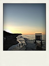 Scenic view of sea at sunset