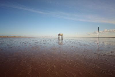 Built structure at beach against sky