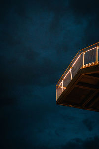 Low angle view of illuminated building against sky