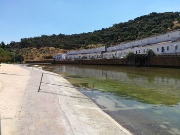 River by building against clear sky