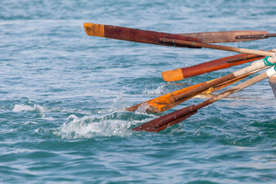 Oars in water, closeup