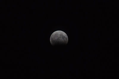 Scenic view of moon against clear sky at night