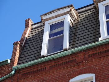 Low angle view of building against clear blue sky
