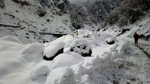 Snow on rocks at mountain during winter