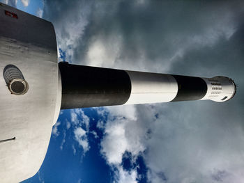 Low angle view of tower against cloudy sky