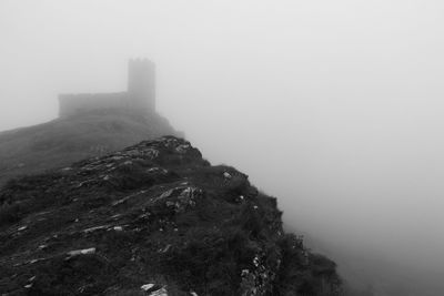 Scenic view of mountains in foggy weather