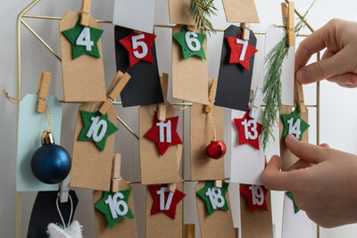 Cropped hand of woman holding christmas presents