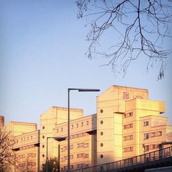 Buildings in city against clear sky