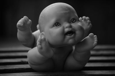 Close-up of doll on bench