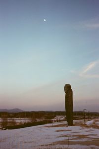 Scenic view of landscape against clear sky during winter