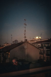 Aerial view of illuminated city against sky at night