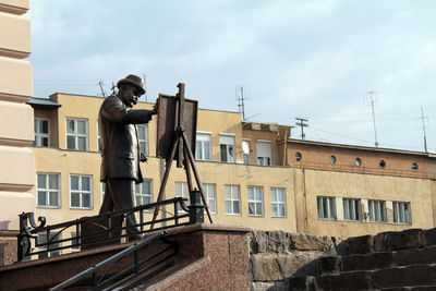 Low angle view of statue against building