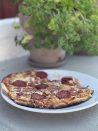 Close-up of pizza served in plate