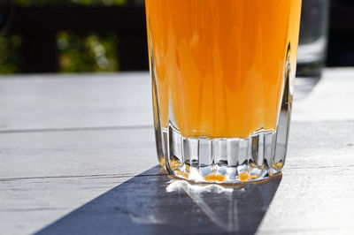 Close-up of juice in glass served on table