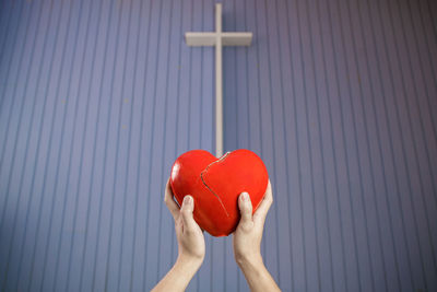 Close-up of hand holding heart shape