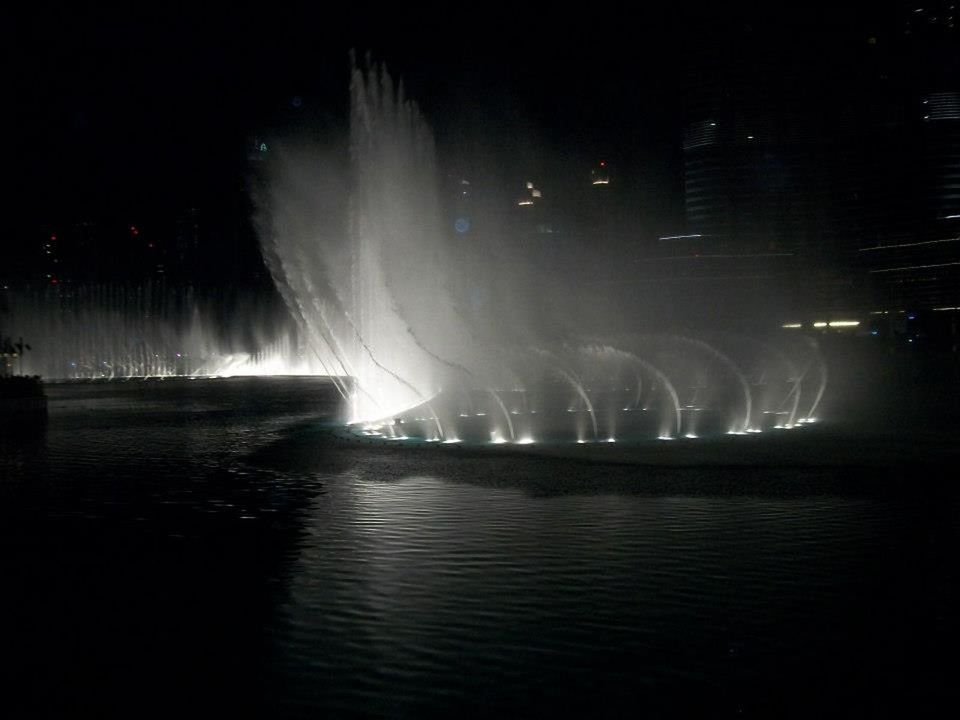 SCENIC VIEW OF ILLUMINATED WATERFALL AT NIGHT