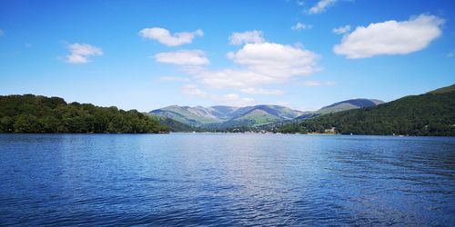 Scenic view of lake against blue sky