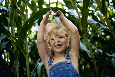 Portrait of smiling girl with plants