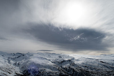 Scenic view of mountains against sky during winter