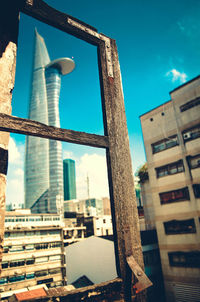 Low angle view of building against blue sky