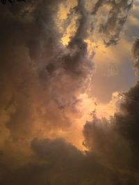 Low angle view of dramatic sky during sunset