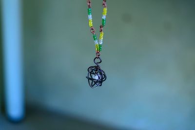 Close-up of pendant on necklace