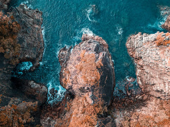 High angle view of rock formation in sea