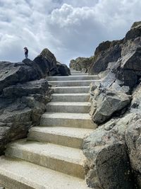 Low angle view of steps on mountain against sky