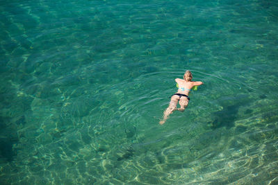 High angle view of person swimming in pool