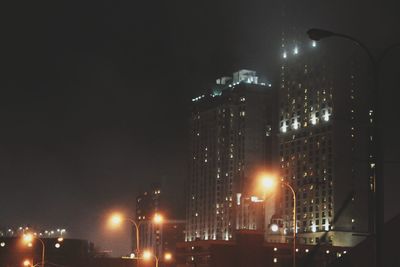 Low angle view of illuminated city at night