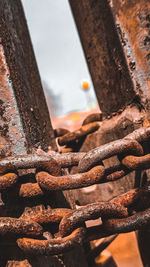 Close-up of hand holding rusty metal