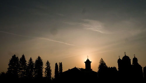 Low angle view of silhouette buildings against sky during sunset