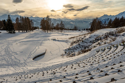 Scenic view of snow covered mountains against sky