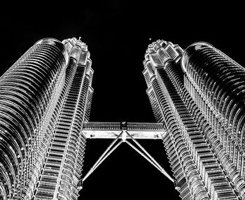 Low angle view of illuminated building against sky at night