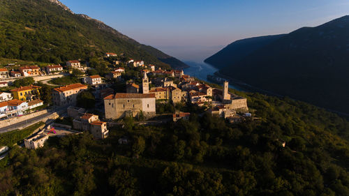 High angle view of trees and buildings against sky