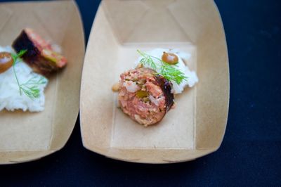 High angle view of appetizer in paper plates on table