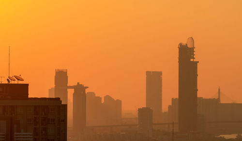 Air pollution in bangkok, thailand. smog and fine dust of pm2.5 covered city in the morning.