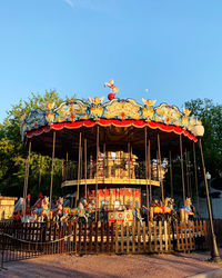 Amusement park ride against clear sky