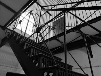 Low angle view of silhouette bridge against sky