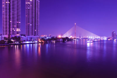 Illuminated buildings at waterfront